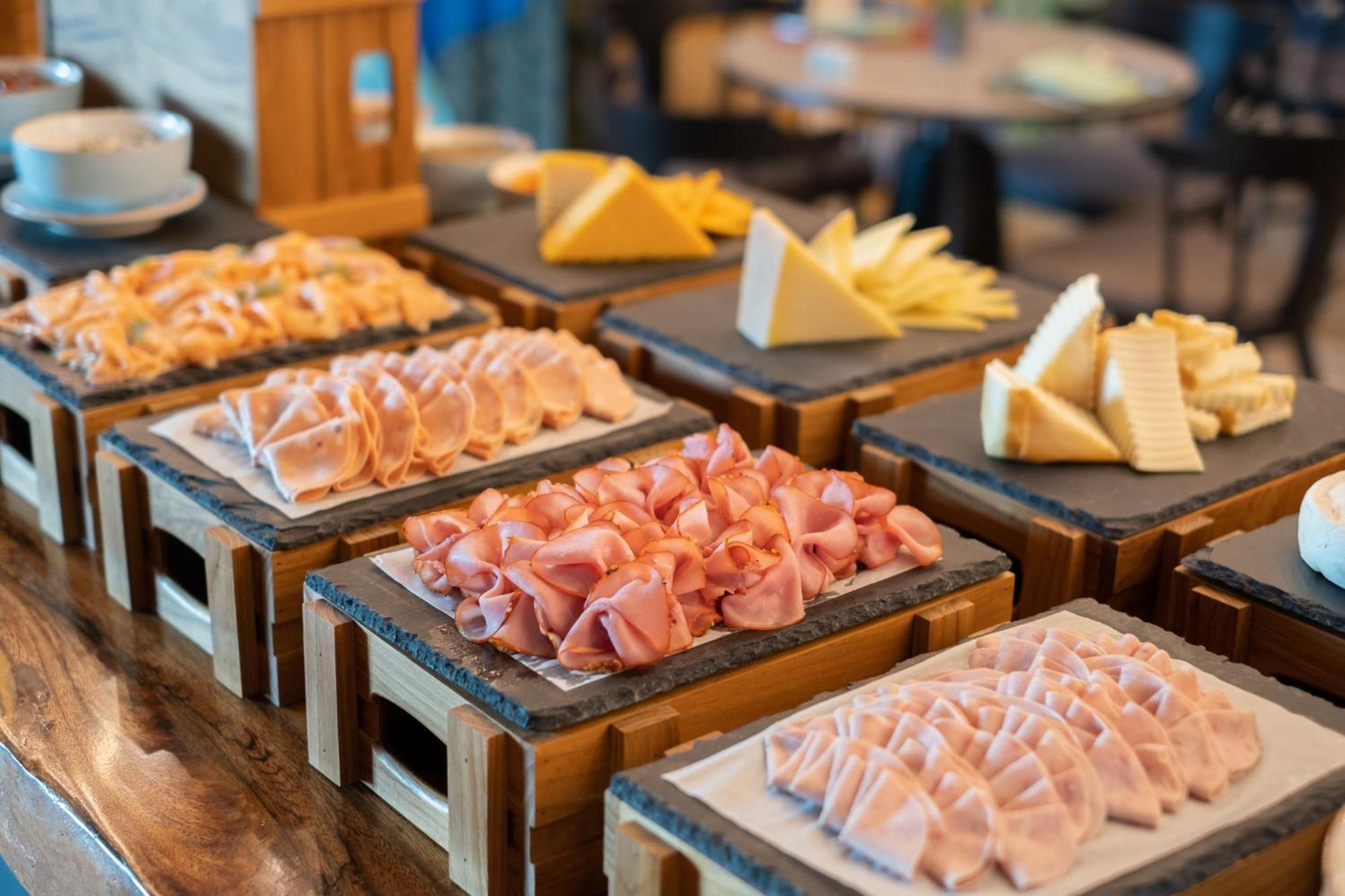 Eastin Grand Hotel Phayathai Bangkok Exterior photo A selection of cold cuts and cheese